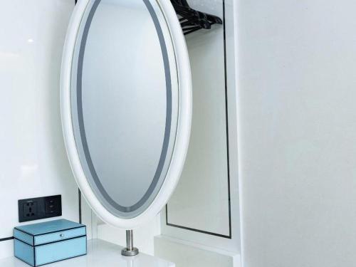 a bathroom with a mirror and a blue box at Xana Hotelle Xi'an GONG IP South Gate of Zhonglou in Xi'an