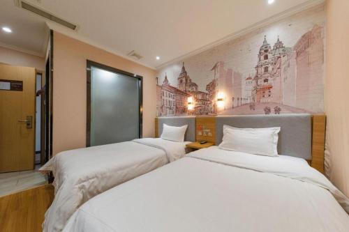 Ένα ή περισσότερα κρεβάτια σε δωμάτιο στο 7 Days Premium Qingdao World of Ocean Qingdao University