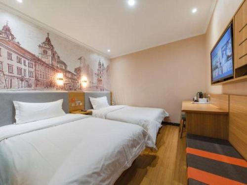 Ένα ή περισσότερα κρεβάτια σε δωμάτιο στο 7 Days Premium Qingdao World of Ocean Qingdao University