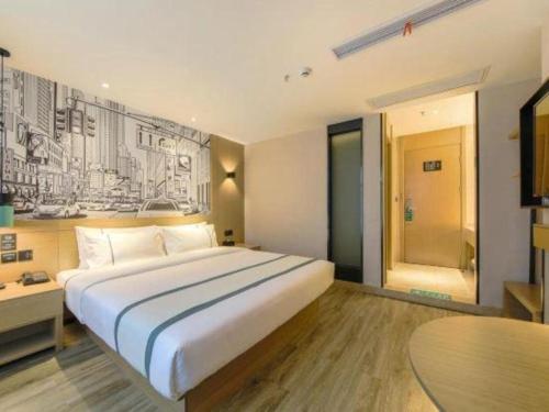 Ένα ή περισσότερα κρεβάτια σε δωμάτιο στο City Comfort Inn Changsha Huanghua Airport Yong'an