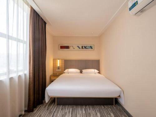 Letto o letti in una camera di City Comfort Inn Zhanjiang South Railway Station