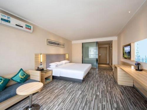 Letto o letti in una camera di City Comfort Inn Zhanjiang South Railway Station