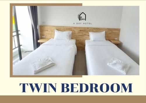Ένα ή περισσότερα κρεβάτια σε δωμάτιο στο A Day Hotel