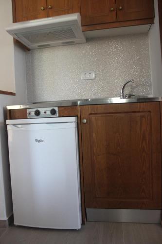 Sunny Suitesにあるキッチンまたは簡易キッチン