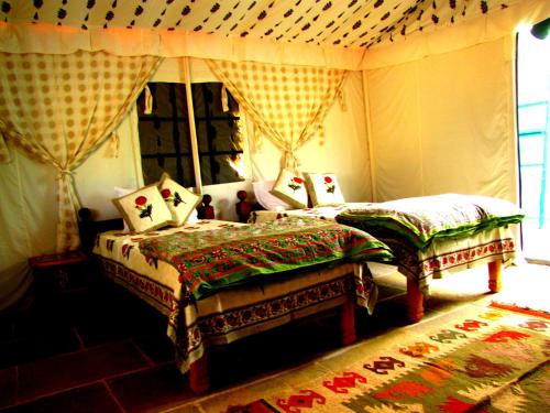 a bedroom with two twin beds and a window at Bohemyan Blue Stay in Alibaug