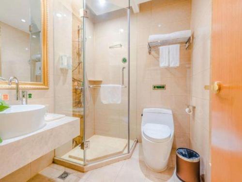 Ένα μπάνιο στο Vienna Hotel Hebei Cangzhou Mingzhu Market