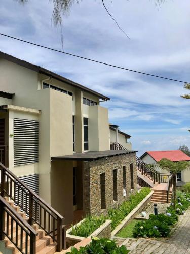 a house with a staircase leading up to it at The Jerai Hill Resort in Yan