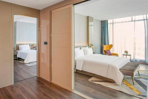 Katil atau katil-katil dalam bilik di Tomeet Hotel