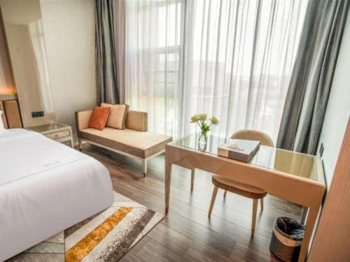 Katil atau katil-katil dalam bilik di Tomeet Hotel