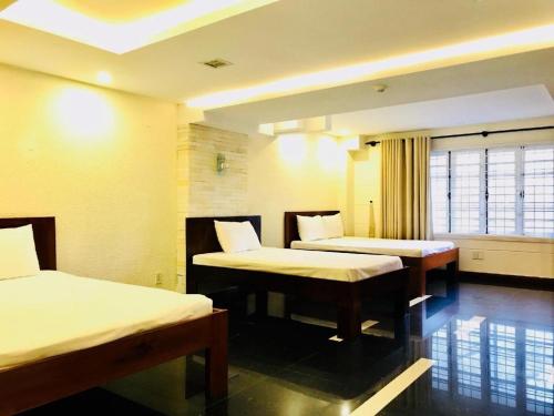Katil atau katil-katil dalam bilik di Whale Ocean View Hotel