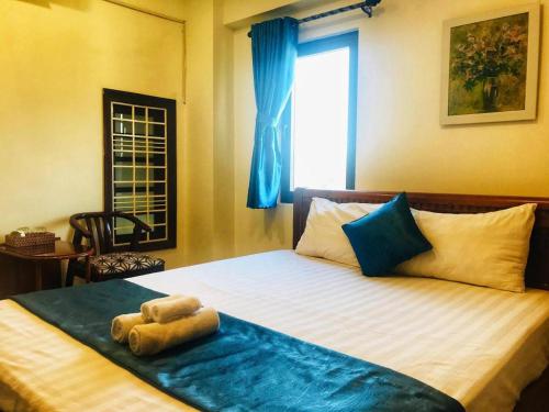 Katil atau katil-katil dalam bilik di Whale Ocean View Hotel