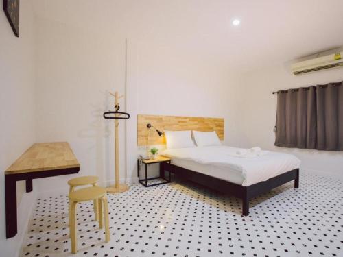 Katil atau katil-katil dalam bilik di Maalamaii Hotel