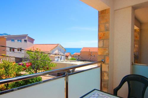 a balcony with a view of the ocean at Mila & Aleksandr Apartments in Budva