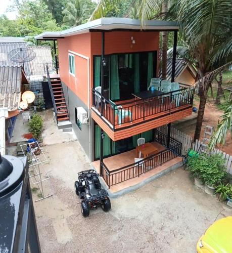 an aerial view of a house with a motorcycle parked outside at Hat yao Seaview Beach Room in Trang