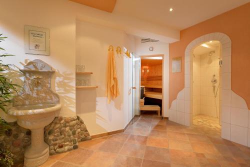 a bathroom with a toilet and a sink in it at Appartements Holiday in Ellmau