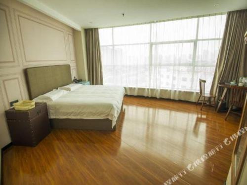 Katil atau katil-katil dalam bilik di GreenTree Inn Binzhou Bus Station