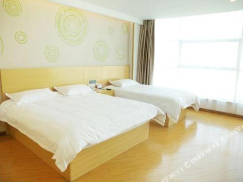 Katil atau katil-katil dalam bilik di GreenTree Inn Binzhou Bus Station