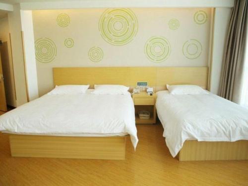 Katil atau katil-katil dalam bilik di GreenTree Inn Binzhou Bus Station
