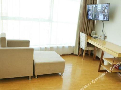 Televisyen dan/atau pusat hiburan di GreenTree Inn Binzhou Bus Station