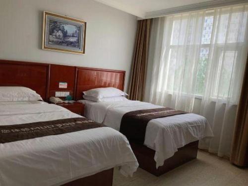 Letto o letti in una camera di GreenTree Inn Beijing Tonzhou Maju Bridge No.2 Express Hotel
