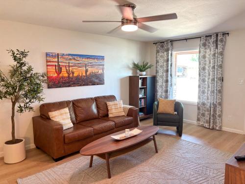 a living room with a couch and a table at Hermosa Hideaway in Tempe