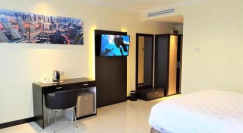Телевизор и/или развлекательный центр в Sunbreeze Hotel