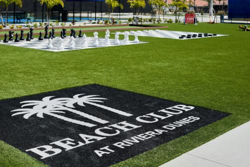 a sign on the grass with a giant chess game at Palmetto Marriott Resort & Spa in Palmetto