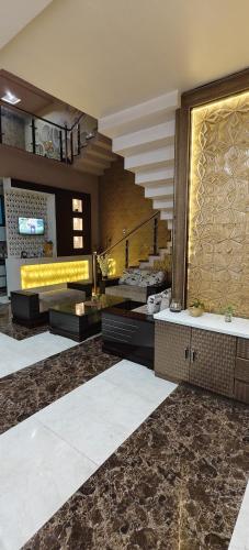 a bathroom with a sink and a large mirror at Banarasi Courtyard in Varanasi
