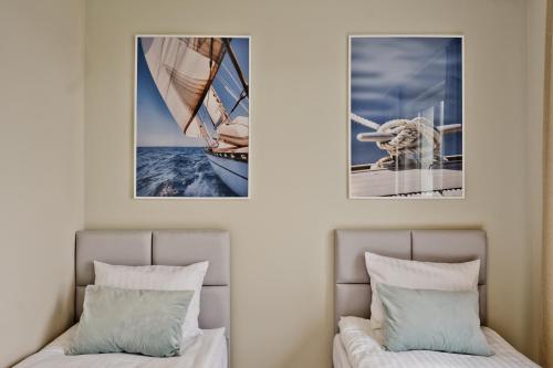 Łóżko lub łóżka w pokoju w obiekcie BlueApart Apartamenty Nexo