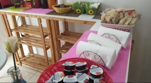 a table with a basket of food on a table at AFFITTACAMERE ANEMONE by Casavacanze di Angelo in Uggiano la Chiesa