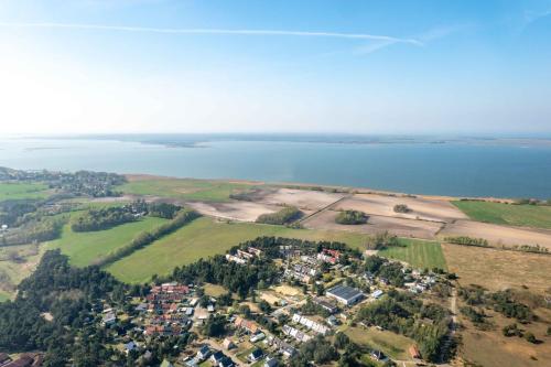 an aerial view of a town next to a body of water at Ferienhaus Kranich in Pruchten