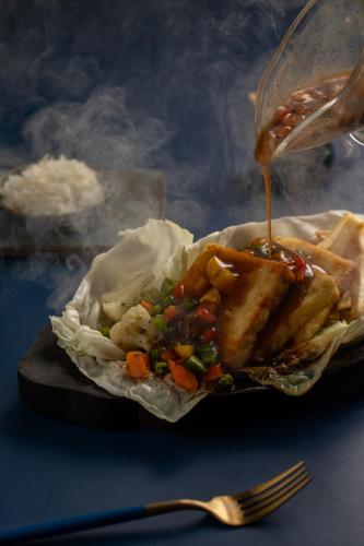 a plate of food with fries and sauce at Pondicherry Executive Inn in Puducherry