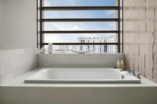a bath tub in a bathroom with a window at JW Marriott, Anaheim Resort in Anaheim