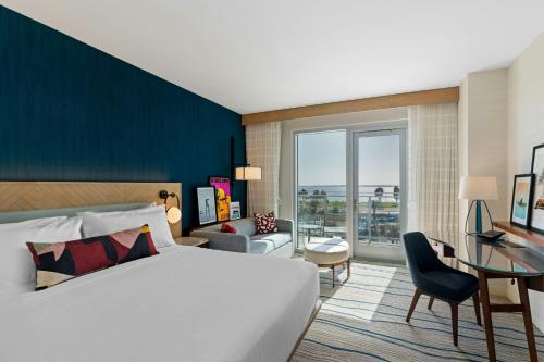 a hotel room with a bed and a desk at Gaylord Pacific Resort & Convention Center in Chula Vista