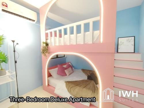 a room with a bed in a little room deluxe apartment at Ipoh Waterpark Manhattan Premium Suites by IWH Suites in Ipoh