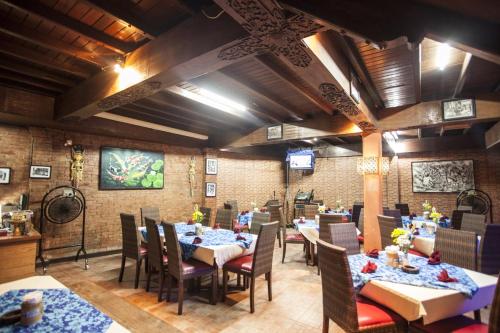 Restoran või mõni muu söögikoht majutusasutuses Satriya Cottages