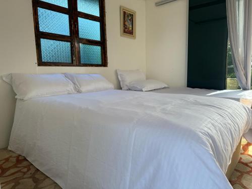 Ένα ή περισσότερα κρεβάτια σε δωμάτιο στο theBukit, Langkawi