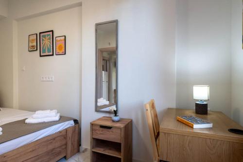 Ένα ή περισσότερα κρεβάτια σε δωμάτιο στο Pomegranate Apartments