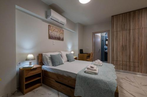 Ένα ή περισσότερα κρεβάτια σε δωμάτιο στο Pomegranate Apartments