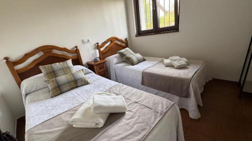 Ένα ή περισσότερα κρεβάτια σε δωμάτιο στο Casa Raquel