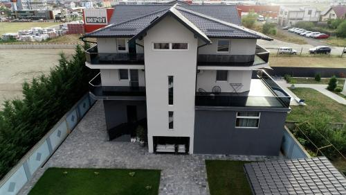 an aerial view of a house with a roof at Grey Residence in Drobeta-Turnu Severin