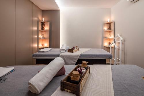 a room with two beds and a tray on the floor at Grand Harilton Otel in Istanbul
