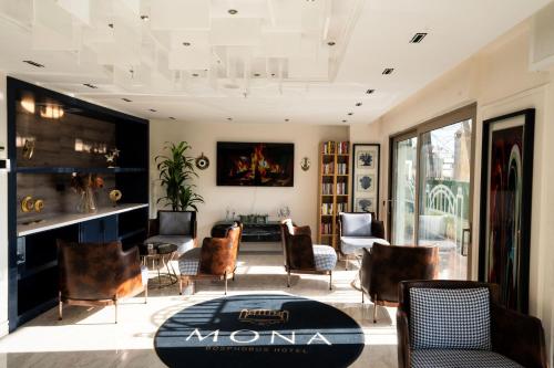 a living room with chairs and a table at Mona Bosphorus in Istanbul