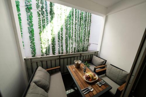 a small room with a table and chairs and a window at Mona Bosphorus in Istanbul