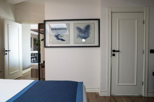 a bedroom with a bed and two pictures on the wall at Mona Bosphorus in Istanbul