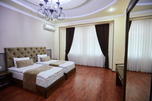 Кровать или кровати в номере Art Elite Hotel