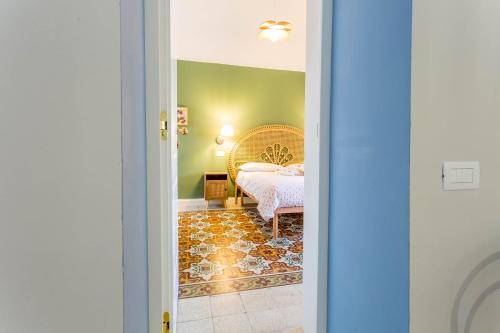 a bedroom with a bed in a room at Cottage in Campomarino old town in Campomarino