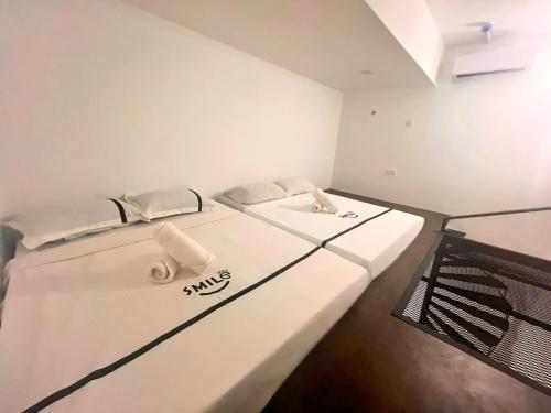 a room with two beds in a room at Seeds Hotel Premier Chow Kit Kuala Lumpur in Kuala Lumpur