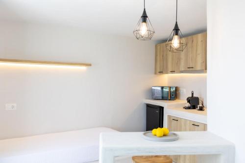 a kitchen with a white table with a yellow duck on it at Christina's Cozy Snuggery in Akrotiri