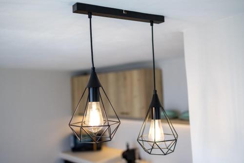 a couple of lights hanging from a ceiling at Christina's Cozy Snuggery in Akrotiri